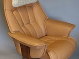 beige leather reclining chair with foot rest and foot rest
