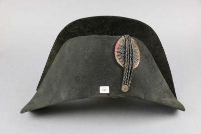 an image of a hat with a feather on the side of it