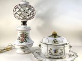 a white table with a bowl and saucer on it