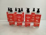 four bottles of hand sanitizer sitting on a white surface