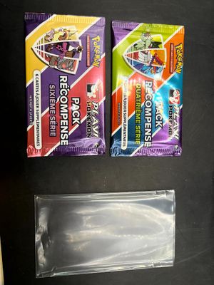 deux tubes de dentifrice et une brosse à dents posés sur une table