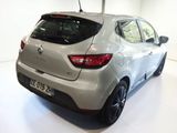 a silver car that is on display in a showroom