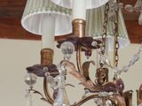 a chandelier that has a bunch of lights hanging from it