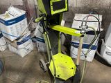 a machine that is sitting on the floor in the garage