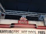 a sign that says hamburgers, hot dogs, fries, and more