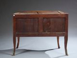 an old wooden cabinet with two doors and a drawer on one side