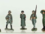 a lot of figurines of soldiers that are standing in a row