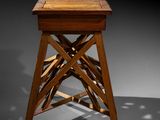an image of a wooden stool sitting on top of a table