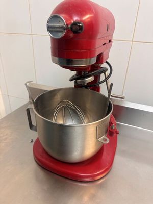 an image of a red mixer on a kitchen counter