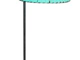 a black table with a green umbrella on it