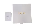 a white box with a gold logo on it next to a white box