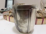 a silver blender sitting on a table next to a basket