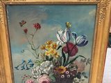 a picture of a painting of flowers in a gold frame