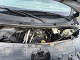 a car that has its hood open with the hood up