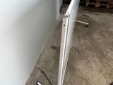 a picture of a metal pole with a sign on it