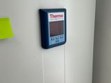 a white refrigerator with a digital display on it