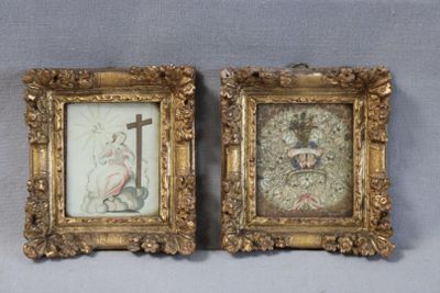 two framed pictures of a woman and a man with a cross on them