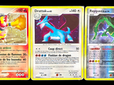 trois cartes Pokémon aux couleurs et aux motifs différents