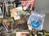 a pile of comic books sitting on top of a table