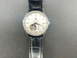 a close up of a wrist watch on a table
