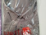 a purple shirt and a purple shirt in a plastic bag