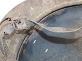 an old metal pot with a handle on it