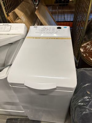 a washing machine and a dryer sitting on the floor