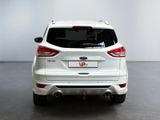 the rear end of a white ford kuga parked in a room