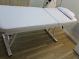 an image of a white table with a fan on top of it