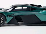 an image of a green and black car on a white background