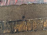 an image of a close up of a piece of fabric with some writing on it