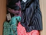a box full of clothing that is sitting on the floor