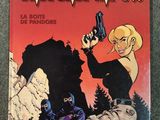 la couverture d'une bande dessinée représentant une femme tenant un pistolet