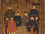 an old painting of a group of people sitting in a room