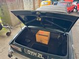 a car that has a box in the trunk of it