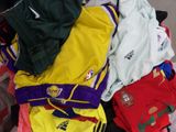 a pile of clothes that is sitting on the floor