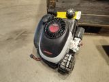 a small lawn mower that is sitting on the ground