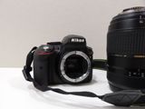 a camera and a lens on a table