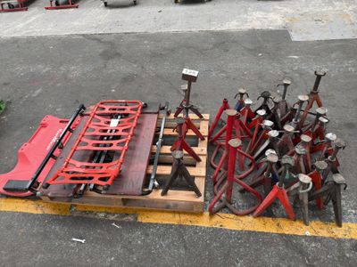 a lot of tools sitting on a pallet in the parking lot
