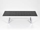 an image of a black and white marble coffee table with chrome legs