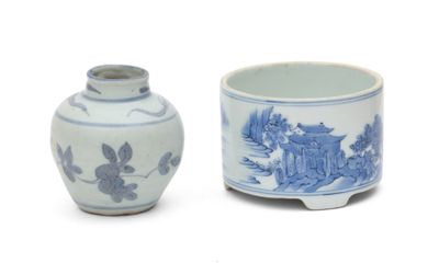 two blue and white vases sitting next to each other on a white surface