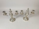 a pair of silver plated candlesticks