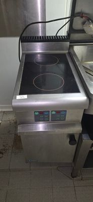 a stove with a burner on it in a kitchen