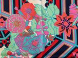 an image of a close up of a colorful floral print fabric