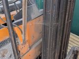 a fork lift truck parked in front of a building