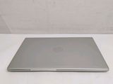 a laptop that is sitting on a white table