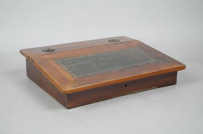 a small wooden box that has a plaque on it