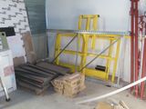 a room that has a lot of boxes and ladders in it