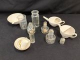 a lot of glass items that are sitting on a table