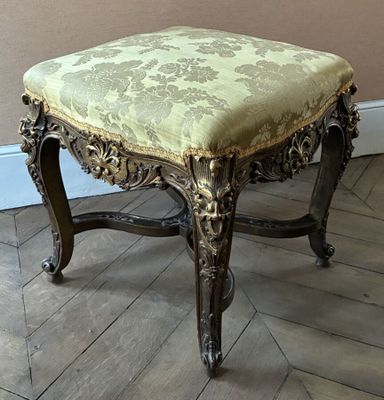 an image of a chair with a green upholstered seat